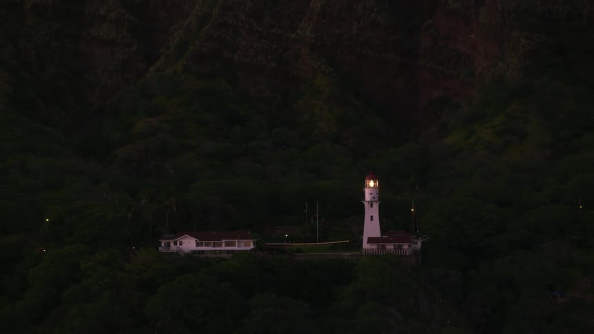 The lighthouse shines on the shore