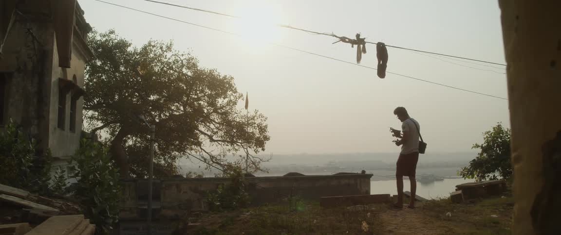 A young man prepares a drone for usage
