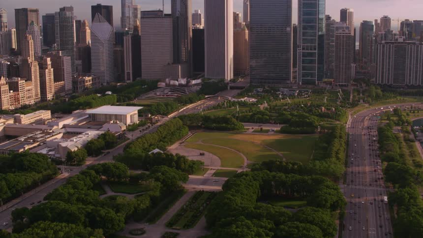 Heavy traffic passes down a highway through downtown