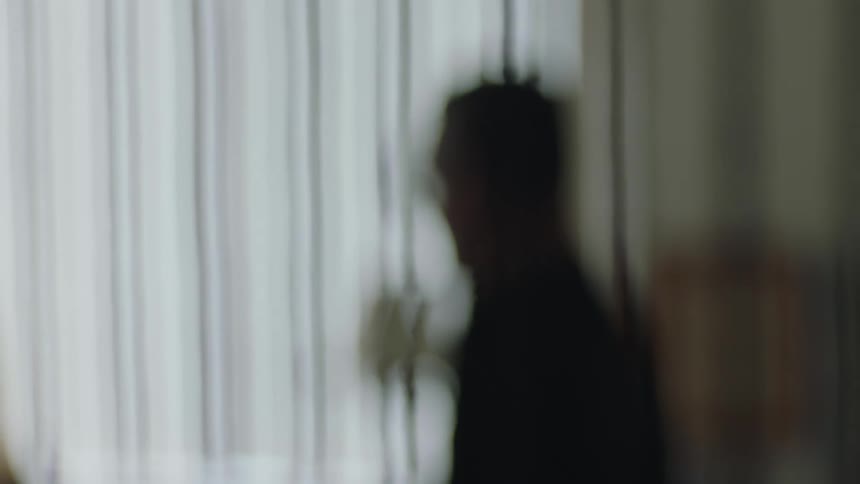 A man is sitting at home