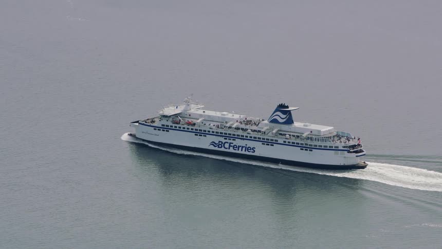Aerial view of british columbia ferry traveling between mainland and vancouver island pacific ocean