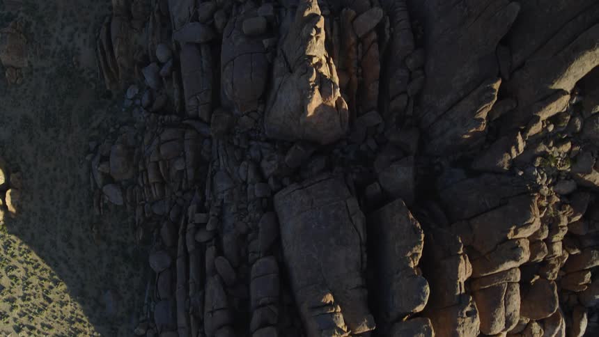 Craggy mountain towers over arid scrubland