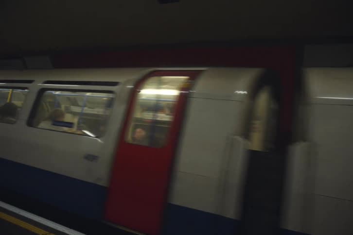 A passenger train pulls into a tube terminal