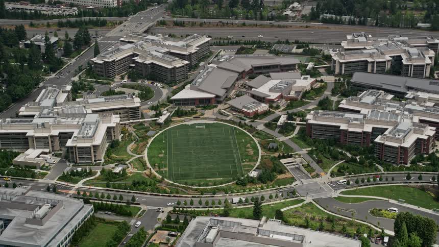 Aerial footage of a soccer field by the Microsoft Campus in Redmond WA during the day