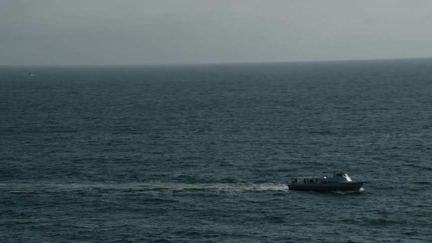 Aerial view of boat traveling on ocean