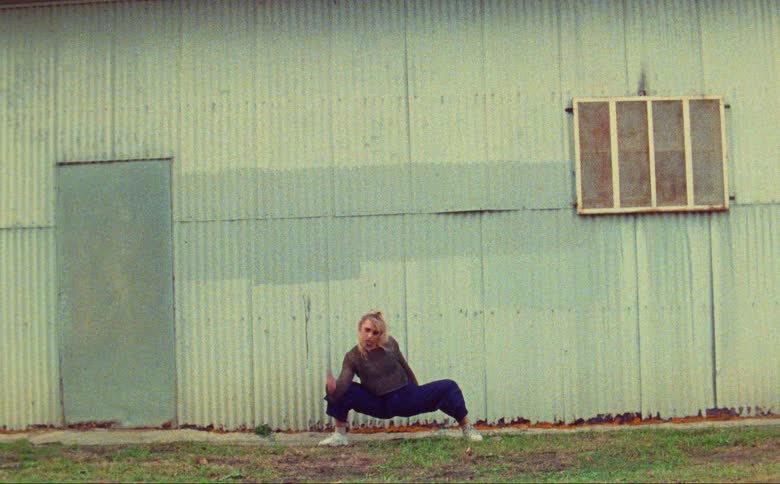 A woman is dancing outside