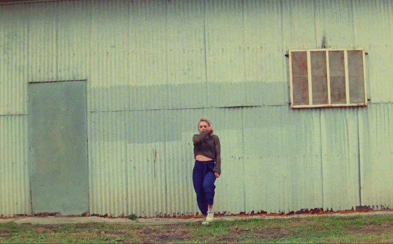 A woman is dancing outside