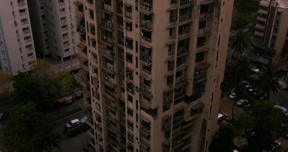 Drone view of an old run down building in a third world country in the middle of the city