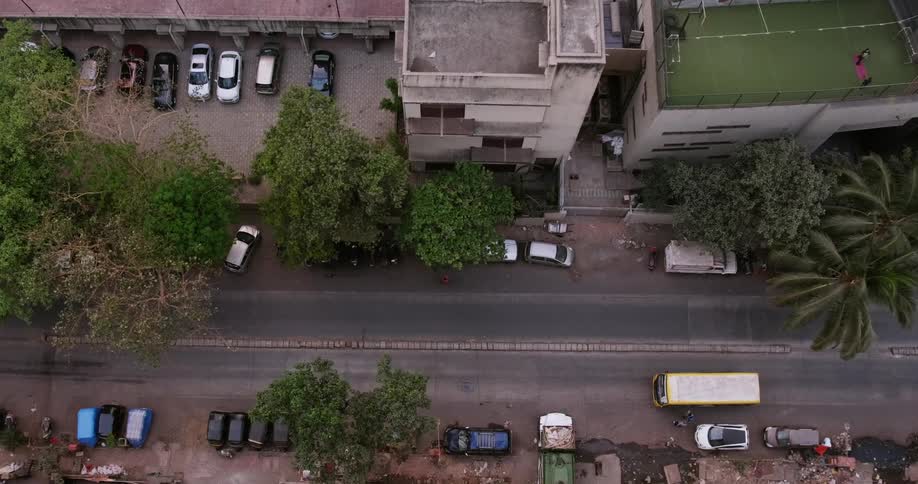 Aerial view of city street with parking lot