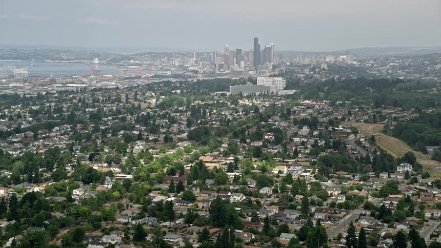 Aerial footage of Seattles skyline viewed from residential neighborhoods of Beacon Hill on a misty day