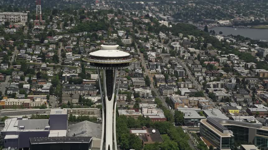 Approaching and flying by the iconic Space Needle this aerial footage showcases downtown Seattle on a sunny day
