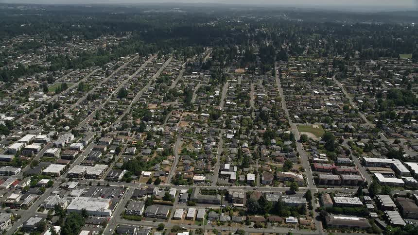 A stunning aerial view of the suburban residential neighborhoods of Edmonds Washington on a partly cloudy day