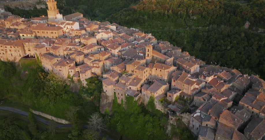 A tightly packed town sits atop a cliff