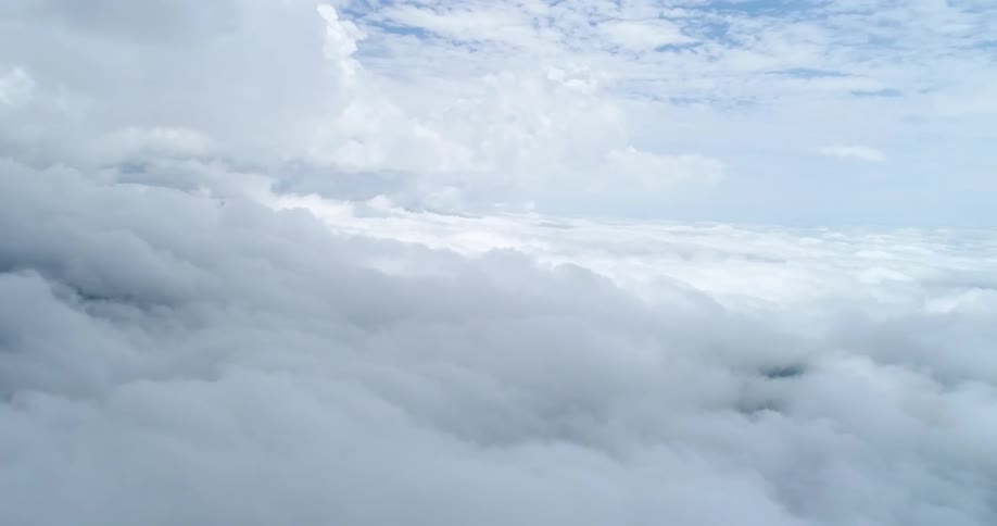Sunlight peaks through dense clouds in the sky