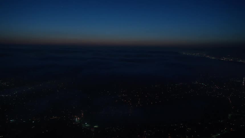  Stunning 4K aerial footage of Los Angeles California at night with the marine layer beautifully covering the city