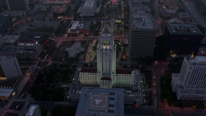 A breathtaking 4K aerial footage of Los Angeles showcasing the stunning skyline and City Hall from an orbiting angle during twilight