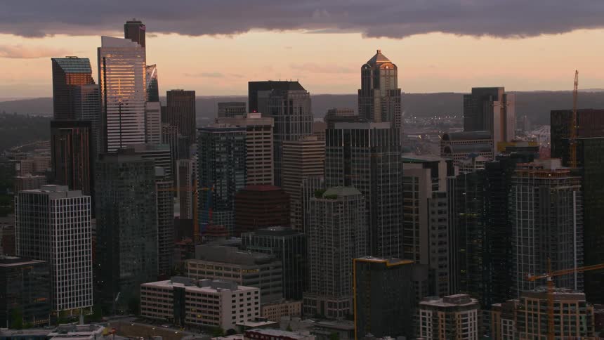 Dark clouds move over tall skyscrapers downtown