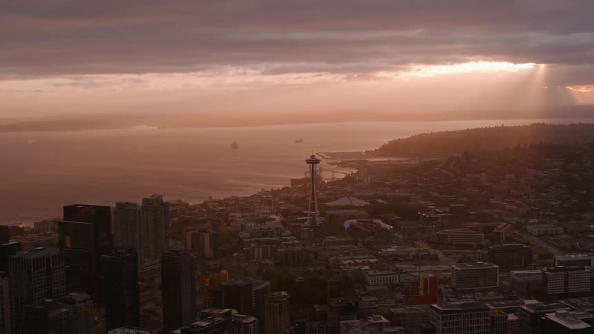 The sun is rising on the city