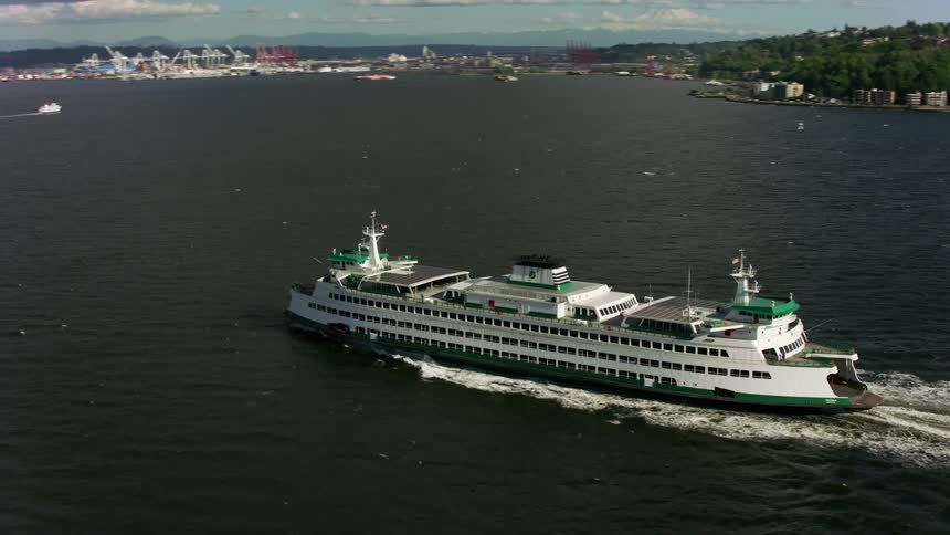 The ferry is traveling towards the city