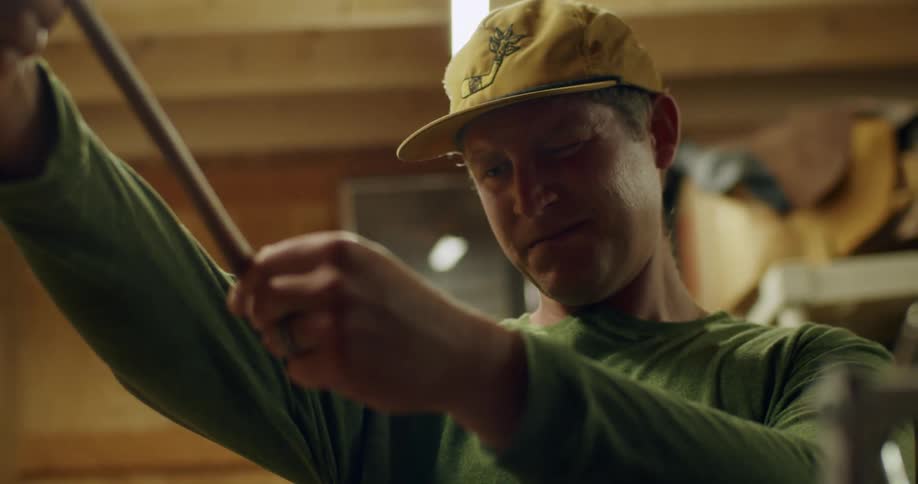 A man examines his golf club