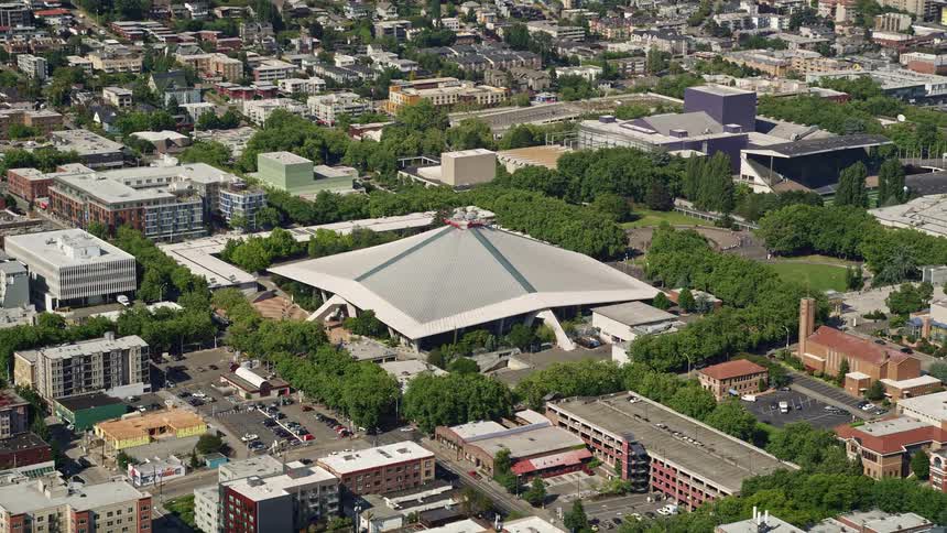 Aerial view of KeyArena multipurpose arena in Downtown Seattle Washington surrounded by a bustling cityscape
