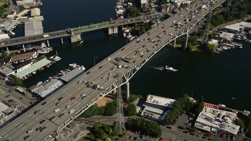 Aerial view of Ship Canal Bridge crossing Lake Union in Seattle Washington on a sunny day showcasing transportation and nature