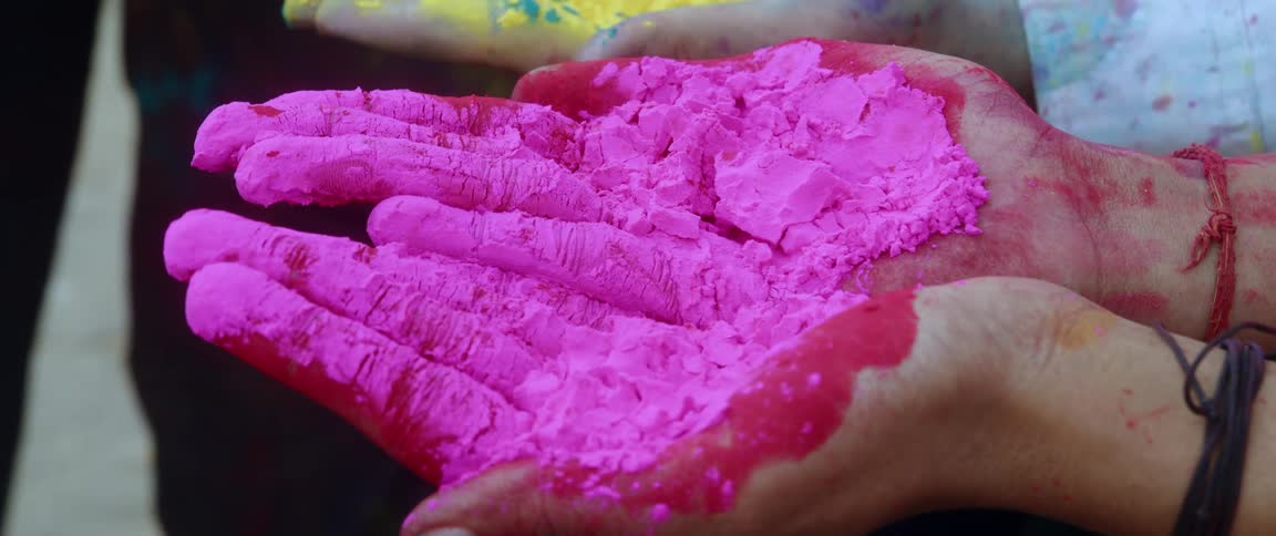 Close up of pink powder in palms