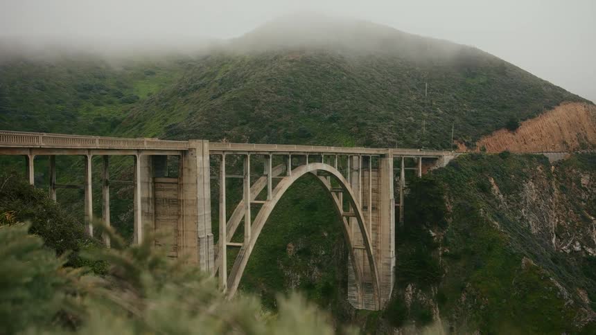 A bridge gaps the mountain top