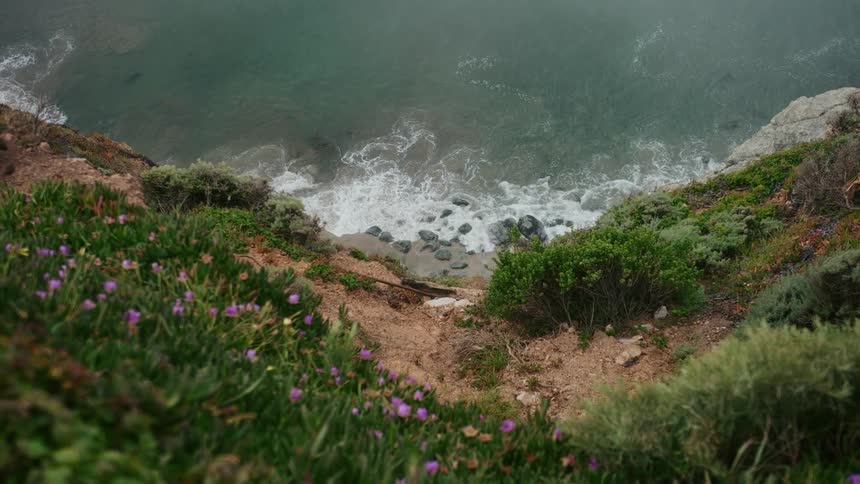 Waves crash against the shore
