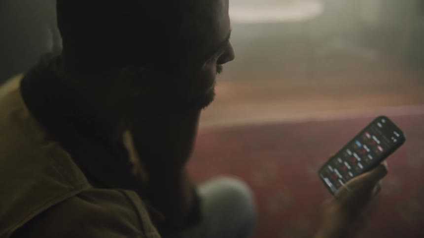 A man is using his cell phone