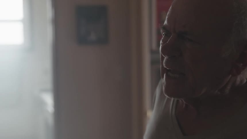 An old man arguing and shouting