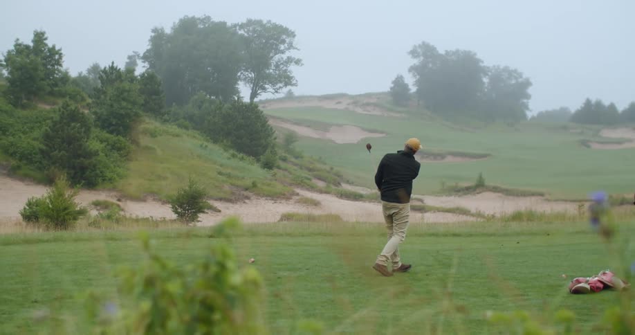 A man drives the golf ball