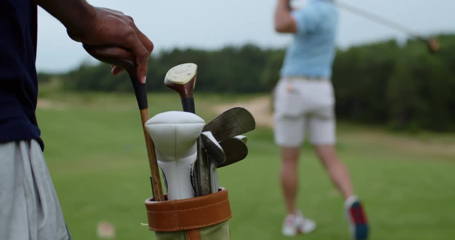 A man drives the golf ball