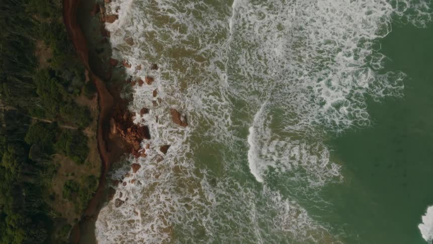 Aerial view of the ocean and beach is displayed