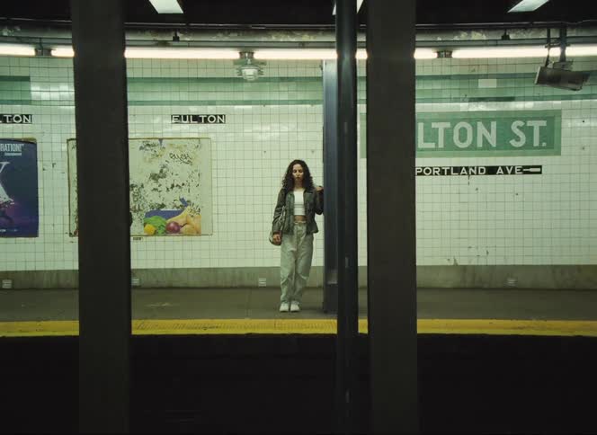 standing on a subway platform