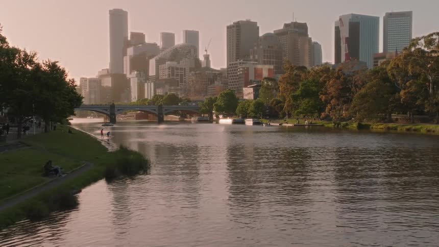 A river crossing a city park