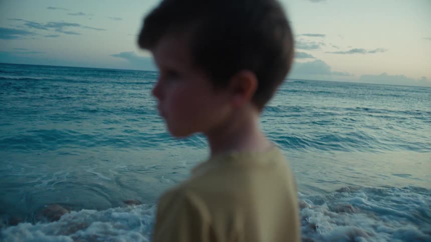 A child watches the ocean