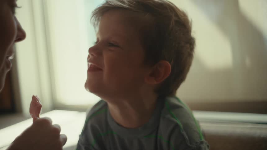 A mother and son eating dessert
