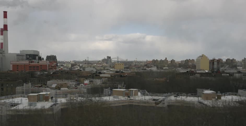 There are heavy clouds above the city ahead