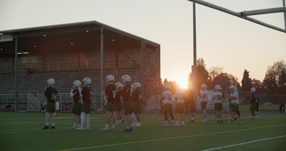 A football team lines up on the field