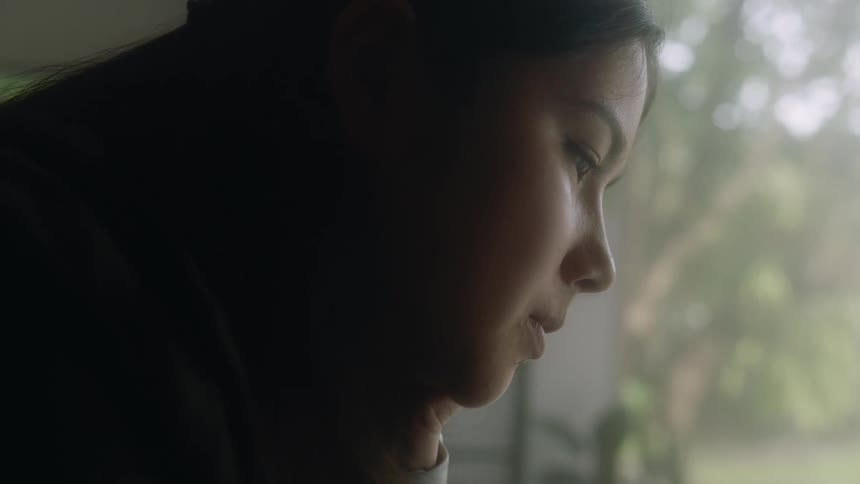 A girl is looking at something