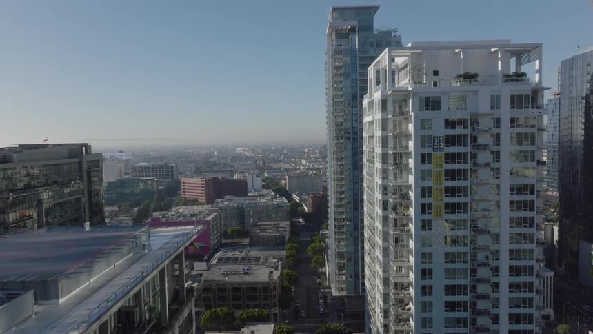 Rows of tall buildings are in the city