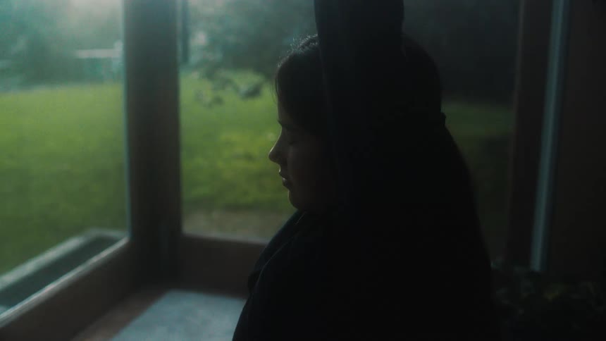 A woman stretching in a room