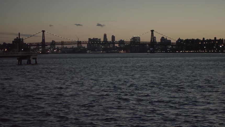 The water before a city is rough at dawn