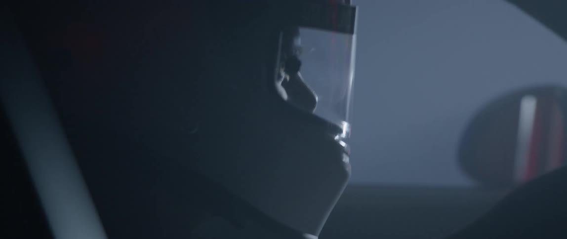 A man is racing in a car