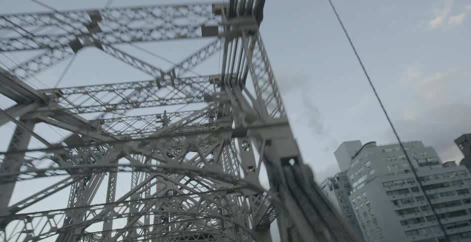 Moving through a bridge towards a city