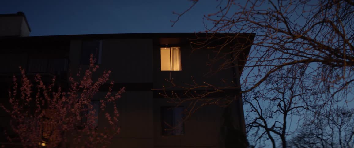 Yellow light in the second floor of a building at night