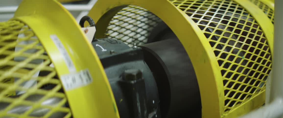 Rotating yellow and black machinery in a factory