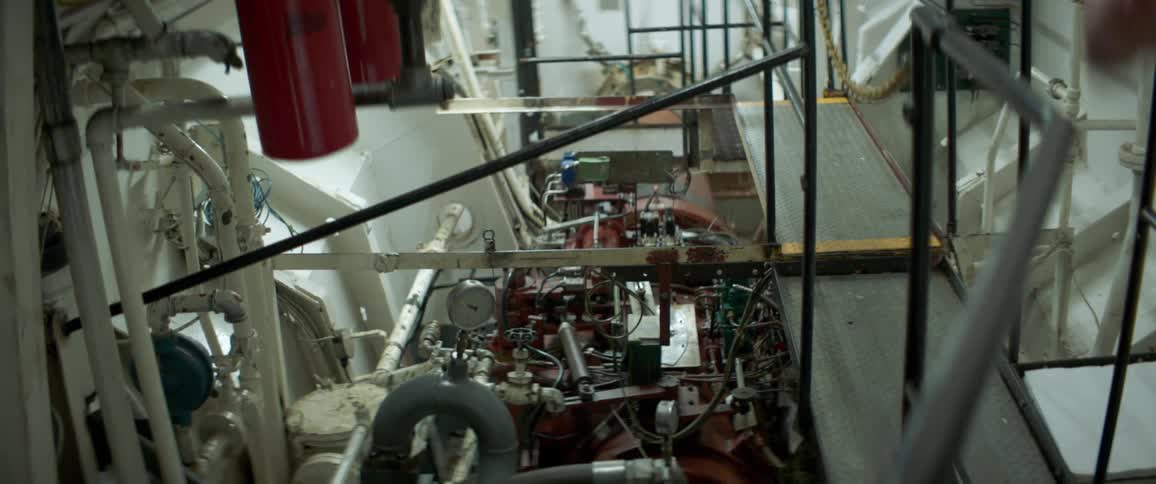 A person watching equipment in a factory