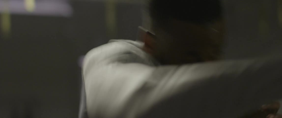 Man doing punching and boxing moves into the air